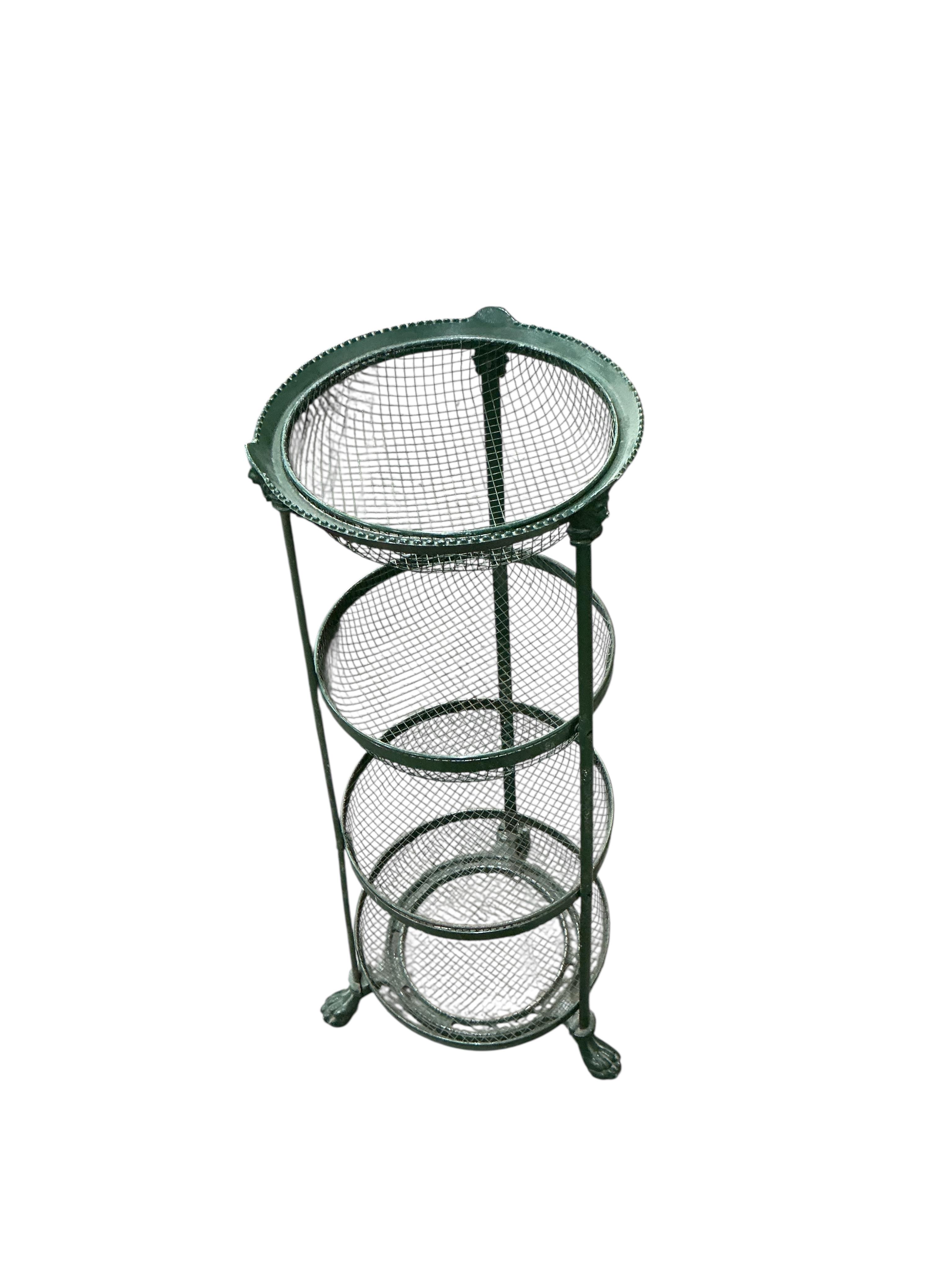 A Victorian style painted cast metal rack, height 85cm